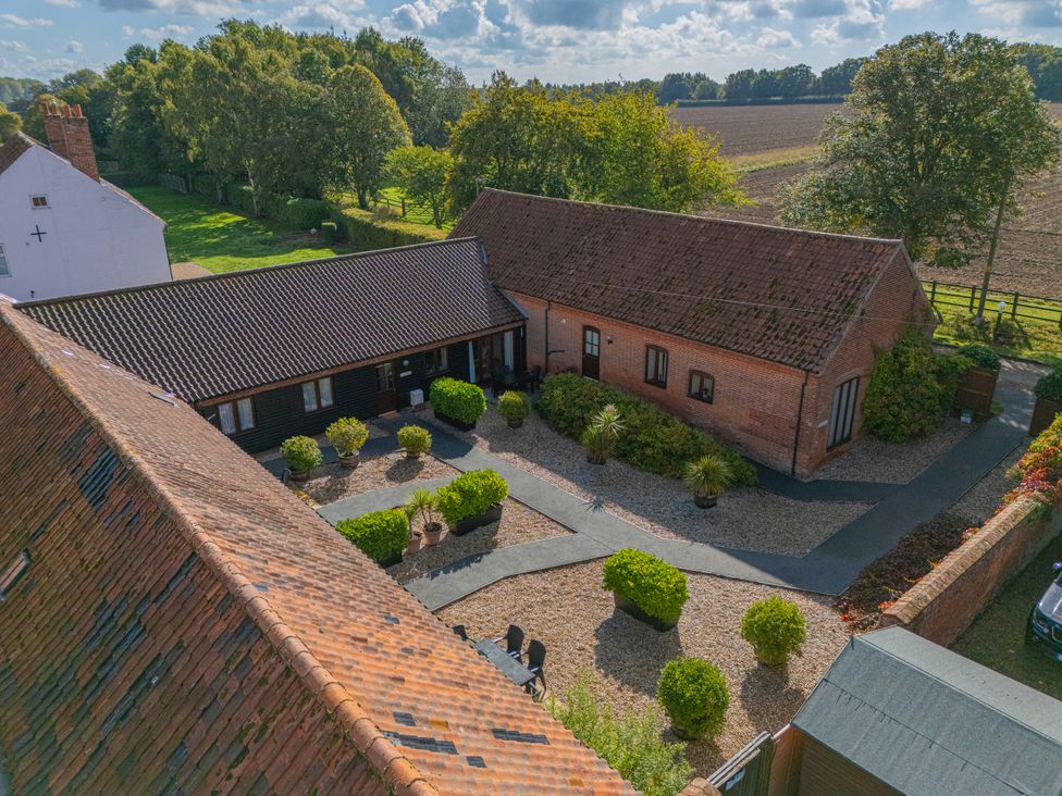 An outdoor view of a property with gardens and pathways at Beechwood near Wood Norton