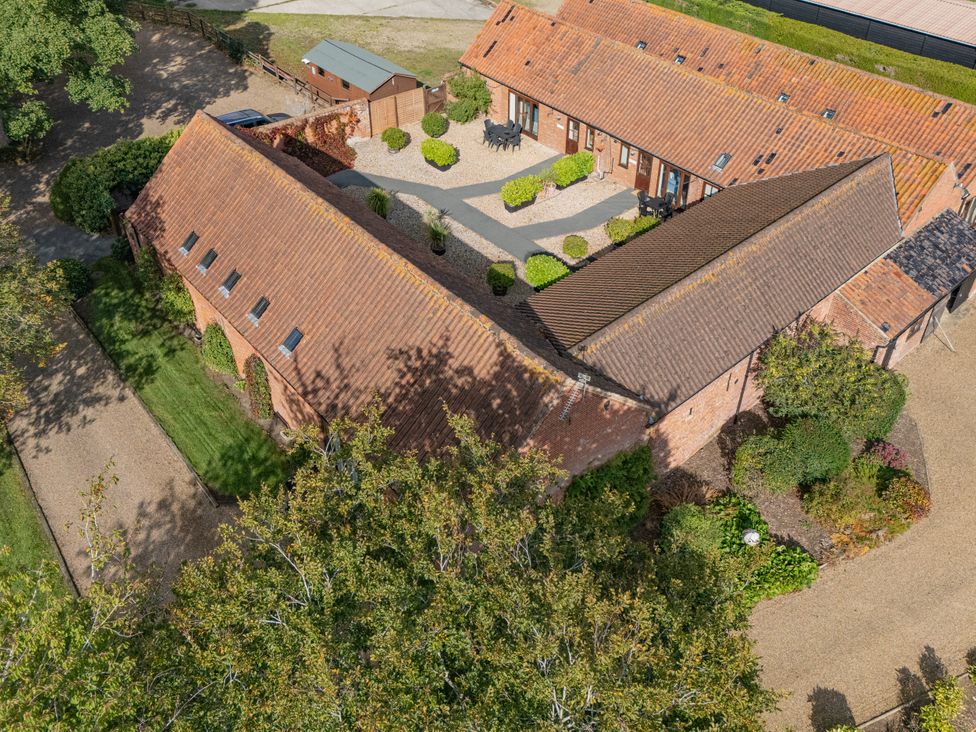 An aerial view of a building with garden and pathway at Pear Tree in Wood Norton