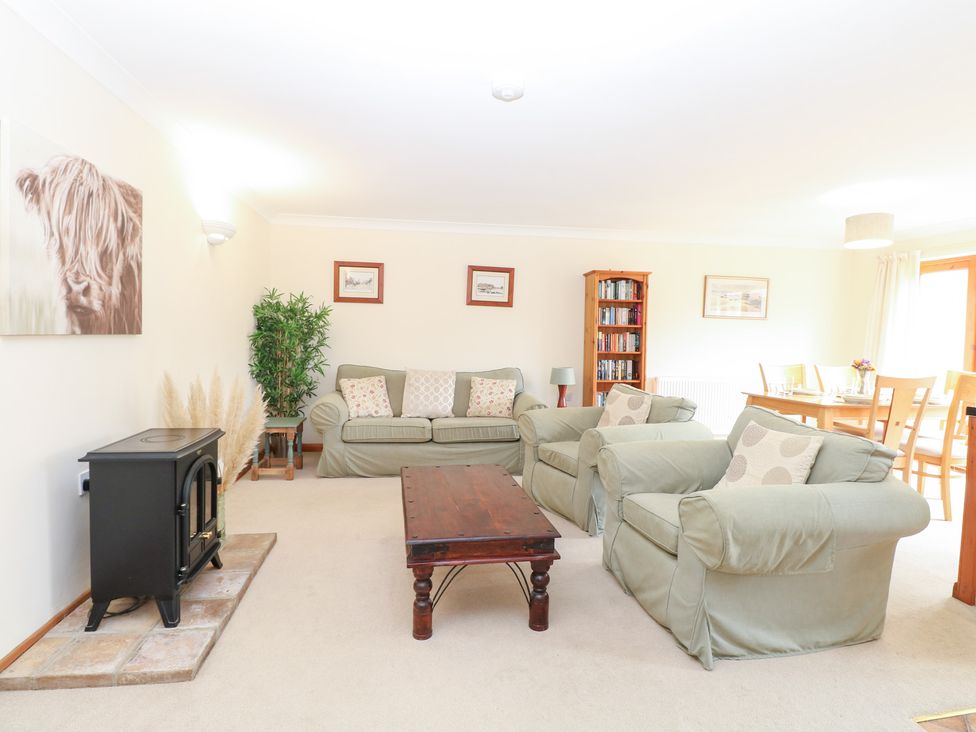 A living room with sofas and a coffee table at Sycamore in Wood Norton near Foulsham