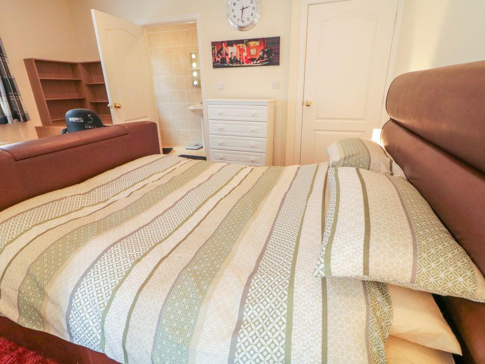A bedroom featuring a bed and furniture at 3 Warke Place, Castlerock