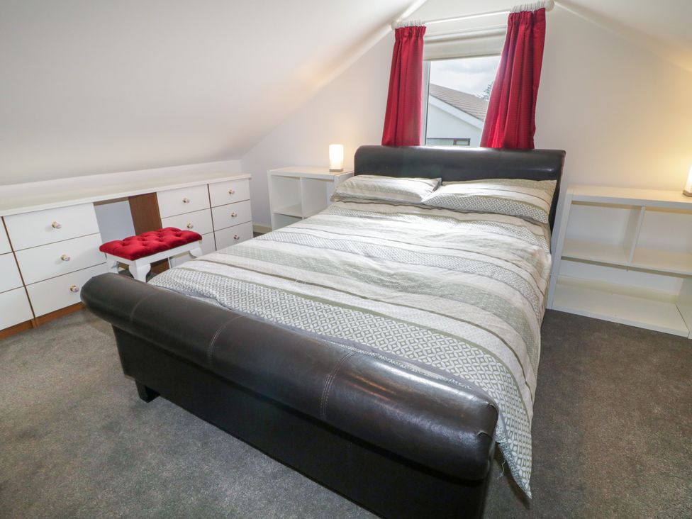 A bedroom with a bed and storage furniture at 3 Warke Place Castlerock