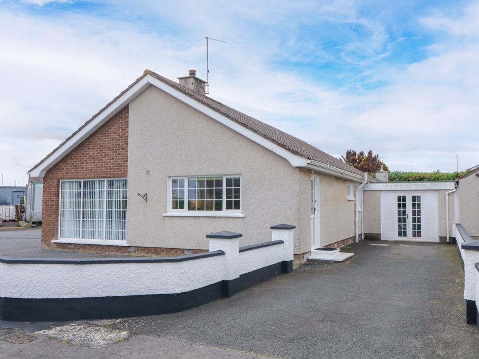 A house with a driveway and garden at 3 Warke Place Castlerock
