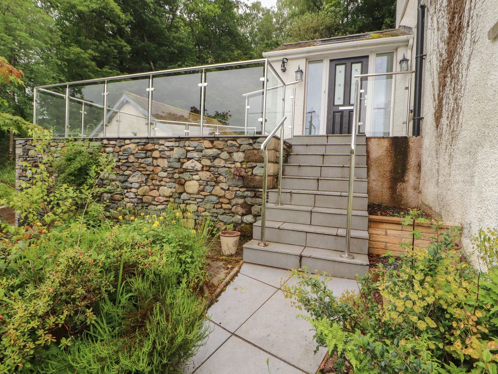 A set of stone steps leading to a house entrance at High Cross in Keswick
