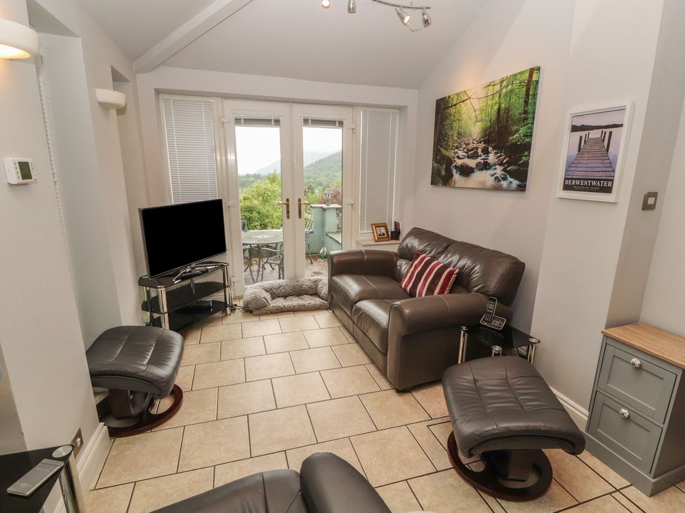 A living room with a sofa and television at High Cross in Keswick