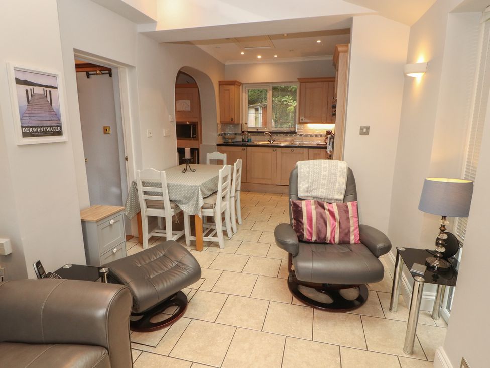 A kitchen with a dining table and chairs at High Cross in Keswick