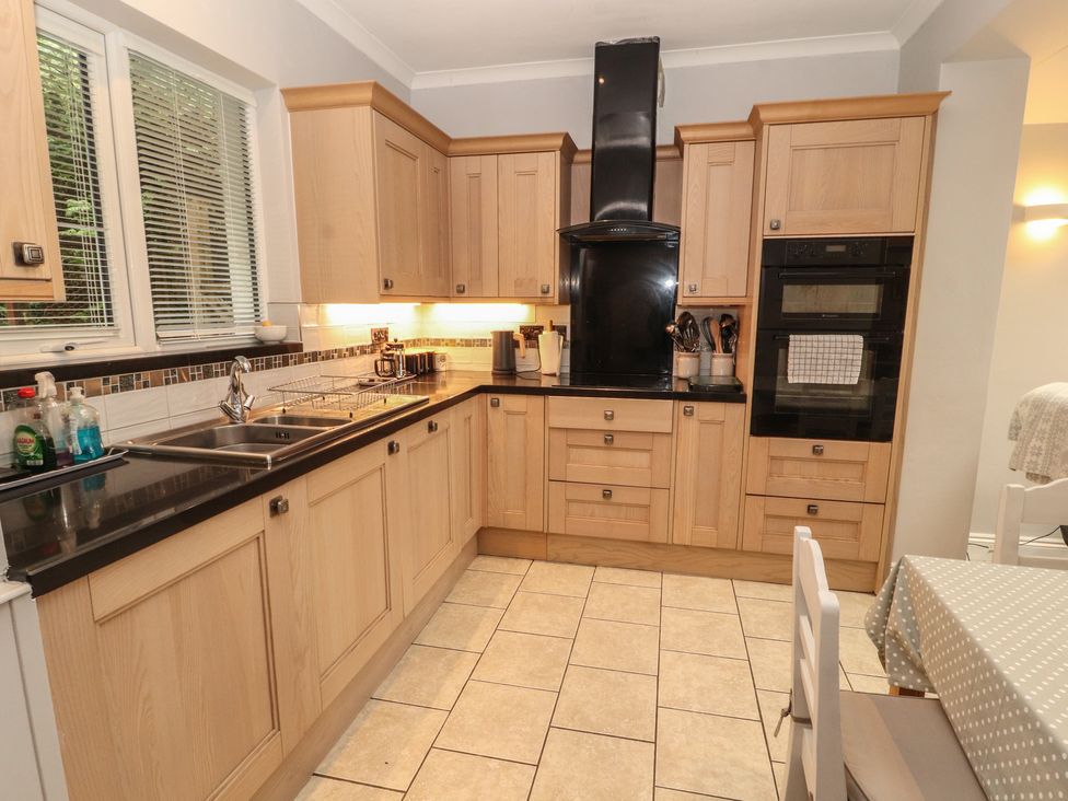 A kitchen with cabinets and appliances at High Cross in Keswick