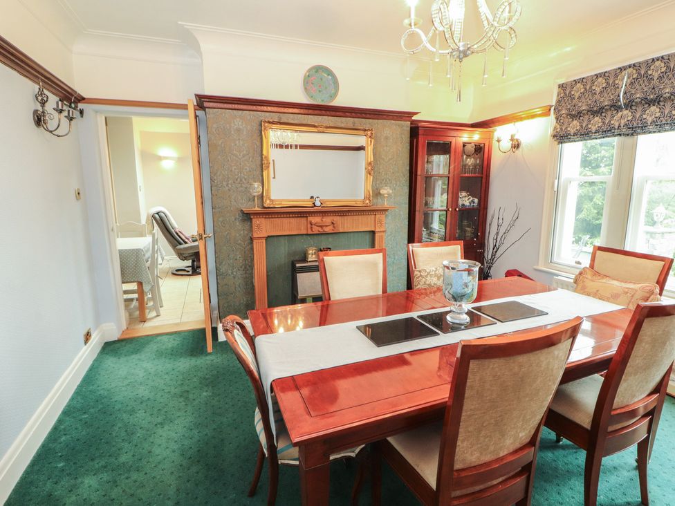 A dining room with a table and chairs at High Cross in Keswick