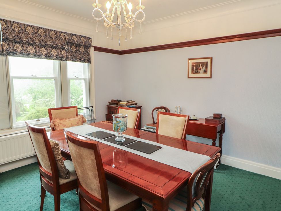 A dining room with a table and chairs at High Cross in Keswick