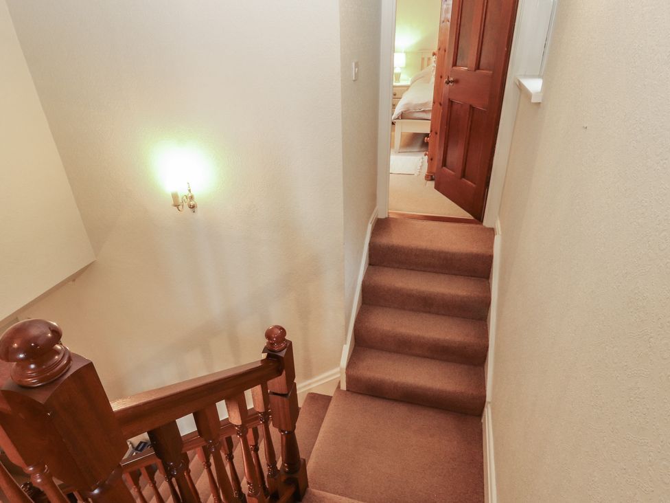 A staircase leading to a door at High Cross in Keswick