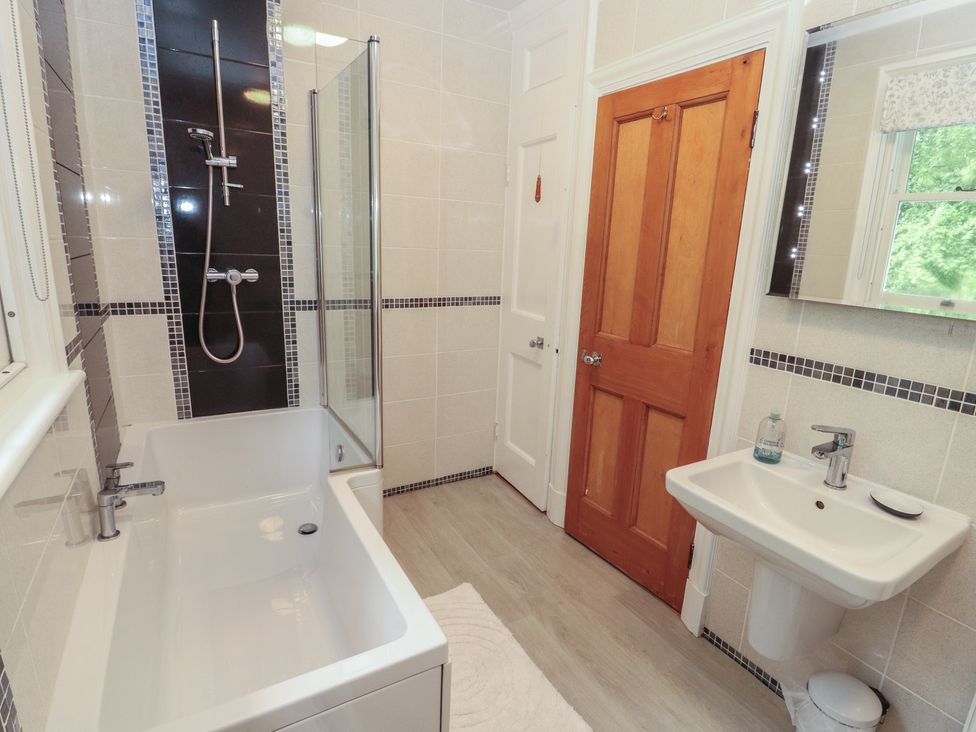 A bathroom with a bathtub and shower at High Cross in Keswick