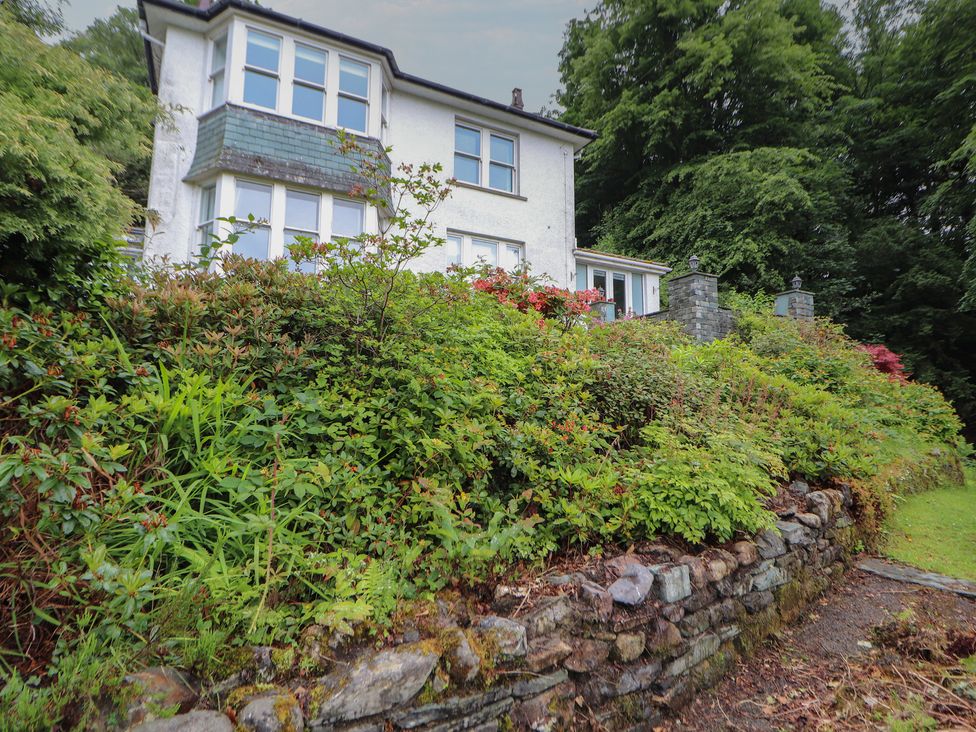 A house with garden and stone wall at High Cross in Keswick