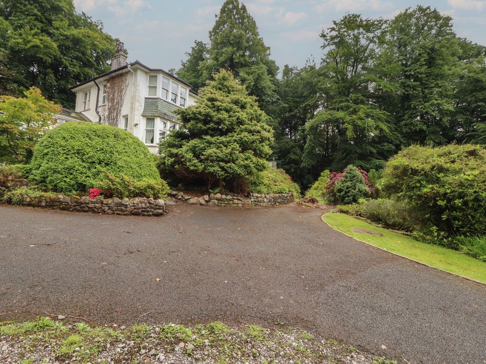 A house with a driveway and greenery at High Cross in Keswick
