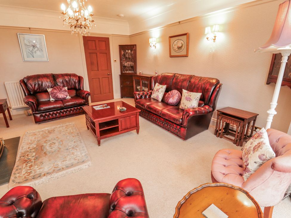 A living room with sofas and a coffee table at High Cross in Keswick