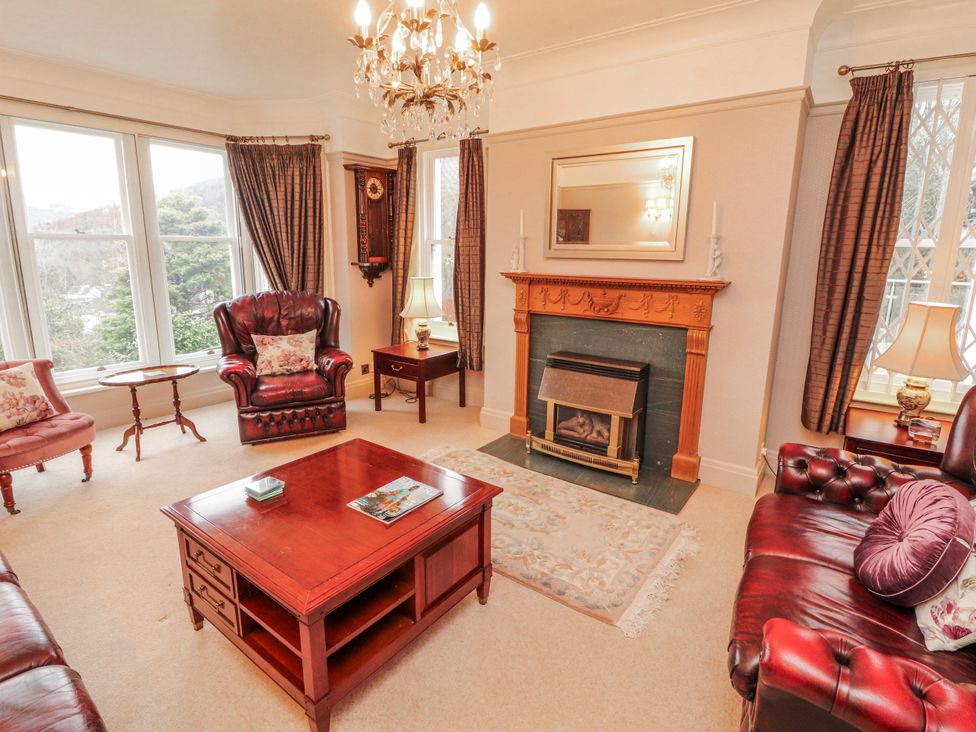 A living room with seating and a fireplace at High Cross in Keswick