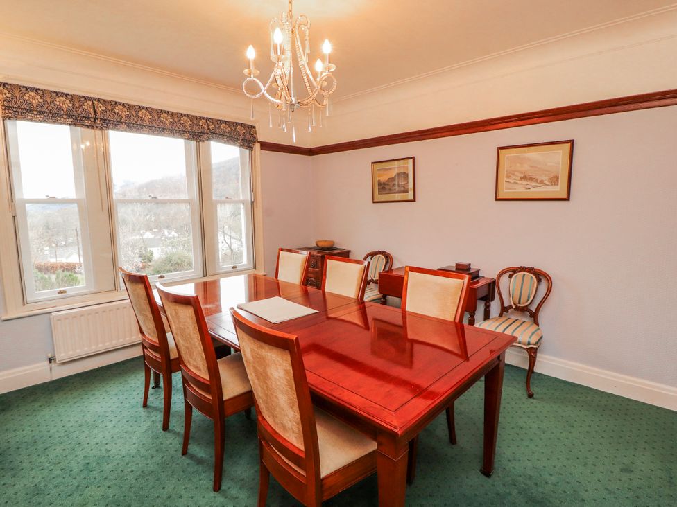 A dining room with a table and chairs at High Cross in Keswick