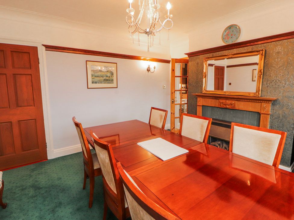A dining room with a table and chairs at High Cross in Keswick
