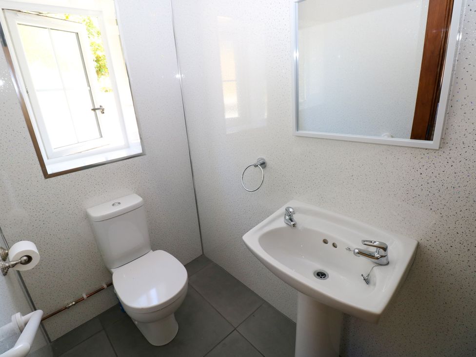 A bathroom with a sink and toilet at Dolcoed in Manordeilo near Llangadog