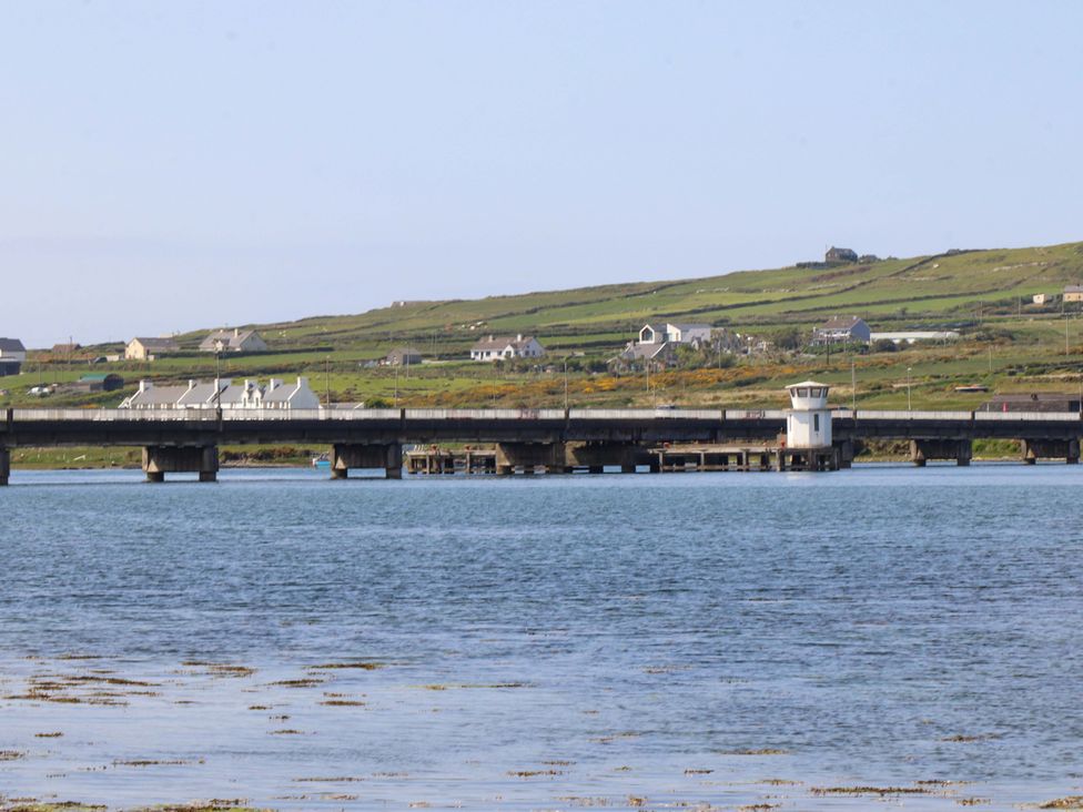 A view of a bridge with nearby houses at O'Conells in Portmagee