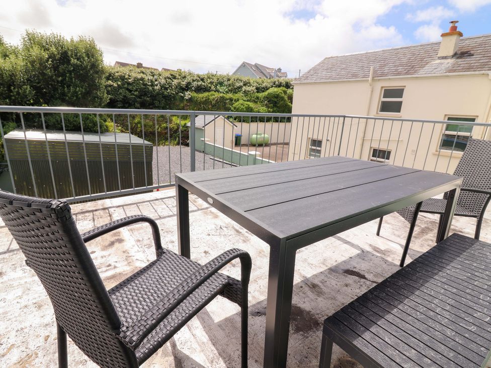 An outdoor area with a table and chairs at O'Connell's Lodge, Portmagee, County Kerry
