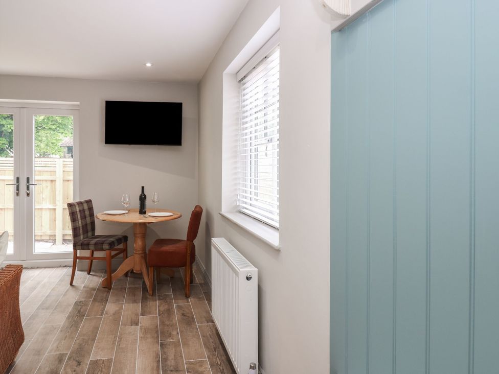 A dining room with a table and chairs at Cottage 10 in Brandon, County Durham