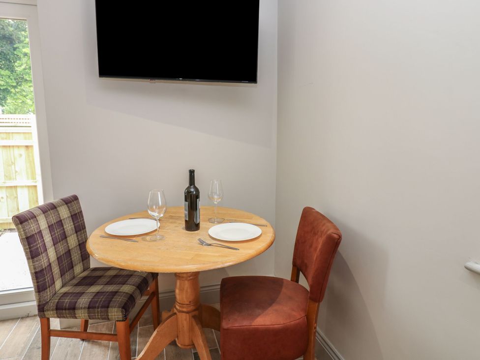 A dining area with a table and chairs at Cottage 10 in Brandon, County Durham