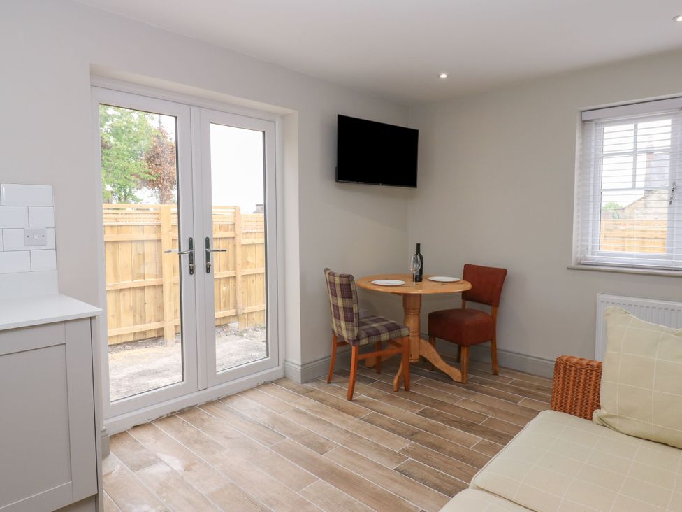 A dining area with a table and chairs at Cottage 10 in Brandon, County Durham