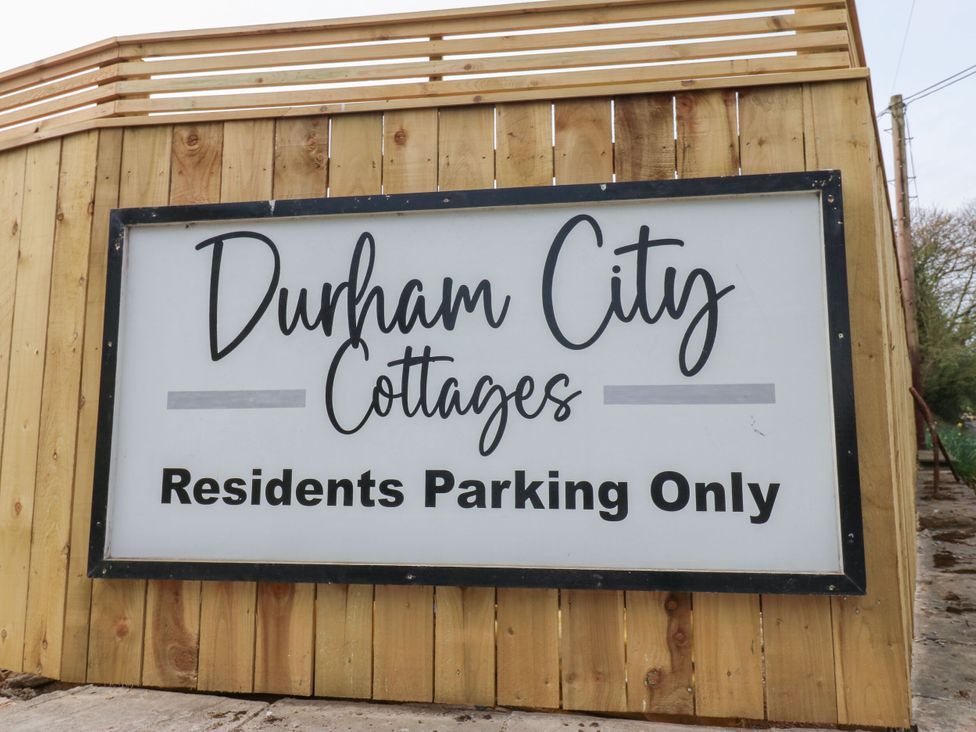 A sign indicating parking restrictions at Durham City Cottages in Brandon, County Durham