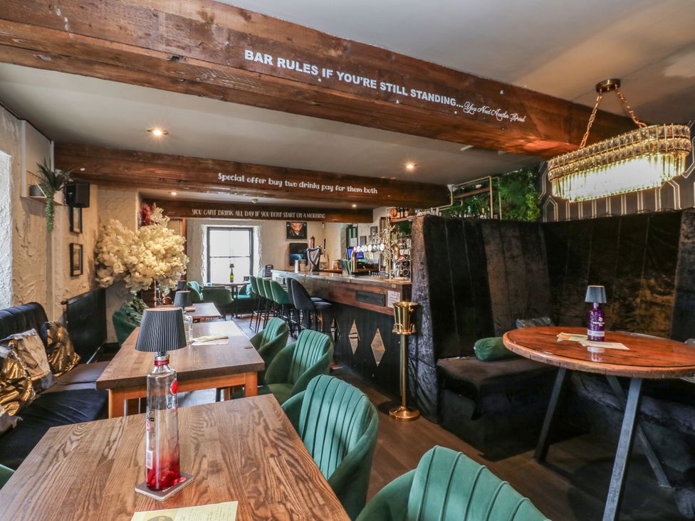 A bar area with seating and a counter at Cottage 10 in Brandon, County Durham