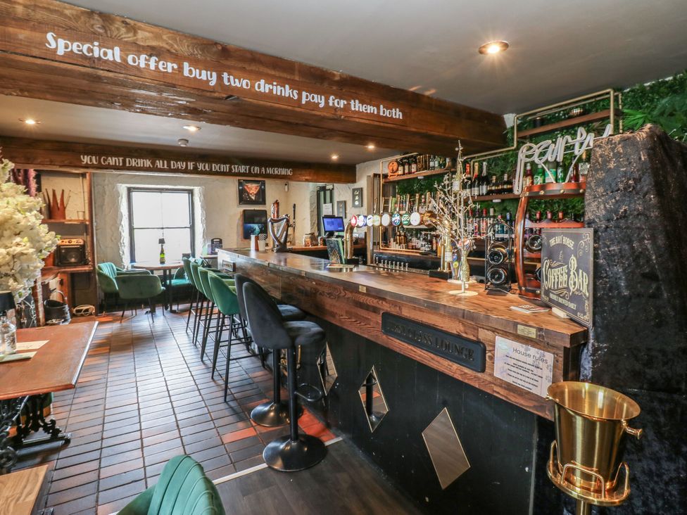 A bar area with stools and a counter at Cottage 10 in Brandon, County Durham