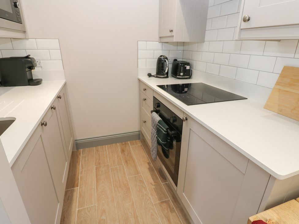 A kitchen with appliances on the countertop at Cottage 9, Brandon, County Durham