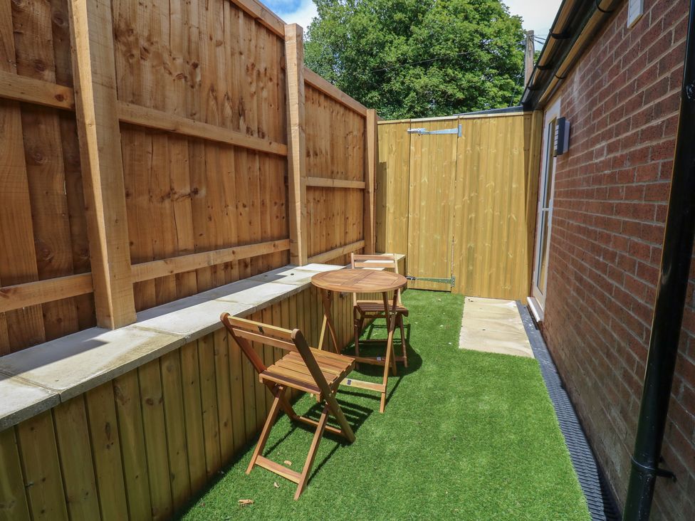 An outdoor space with a table and chairs at Cottage 9 in Brandon, County Durham