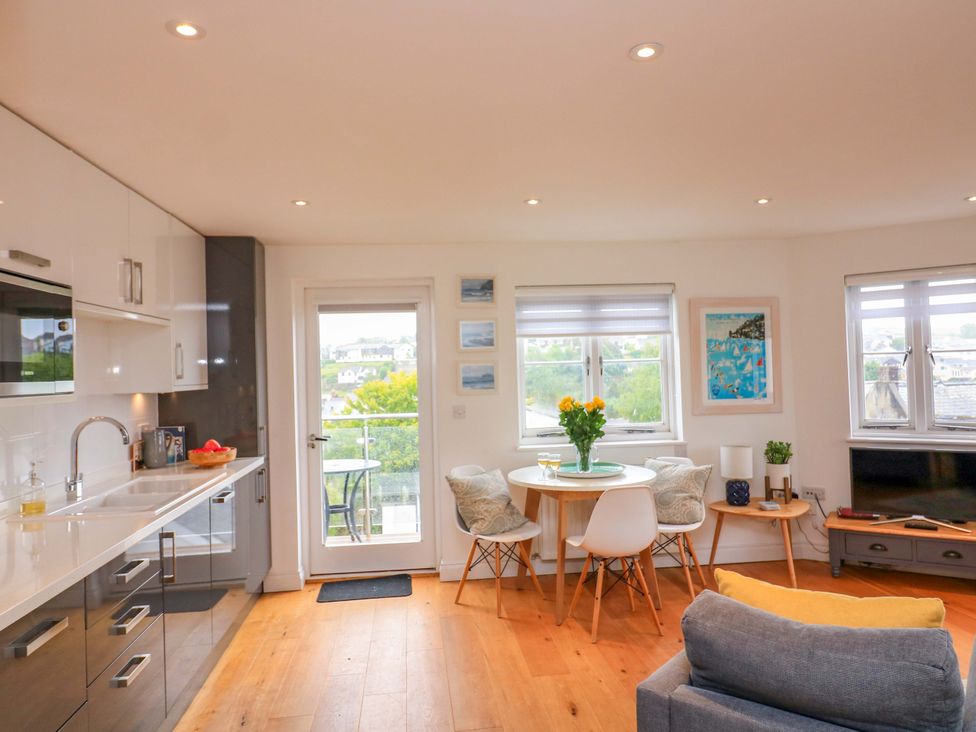 A kitchen with a table and chairs at 61B Fore Street in Kingsbridge