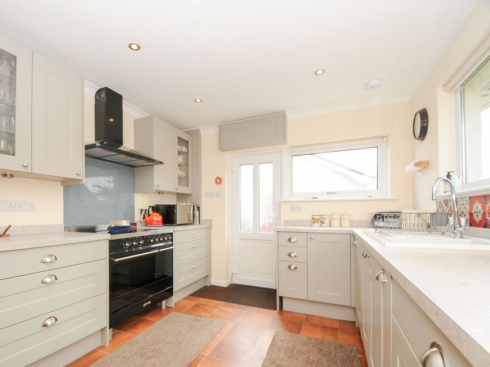 A kitchen with cabinets and a sink at Chimings in Rock