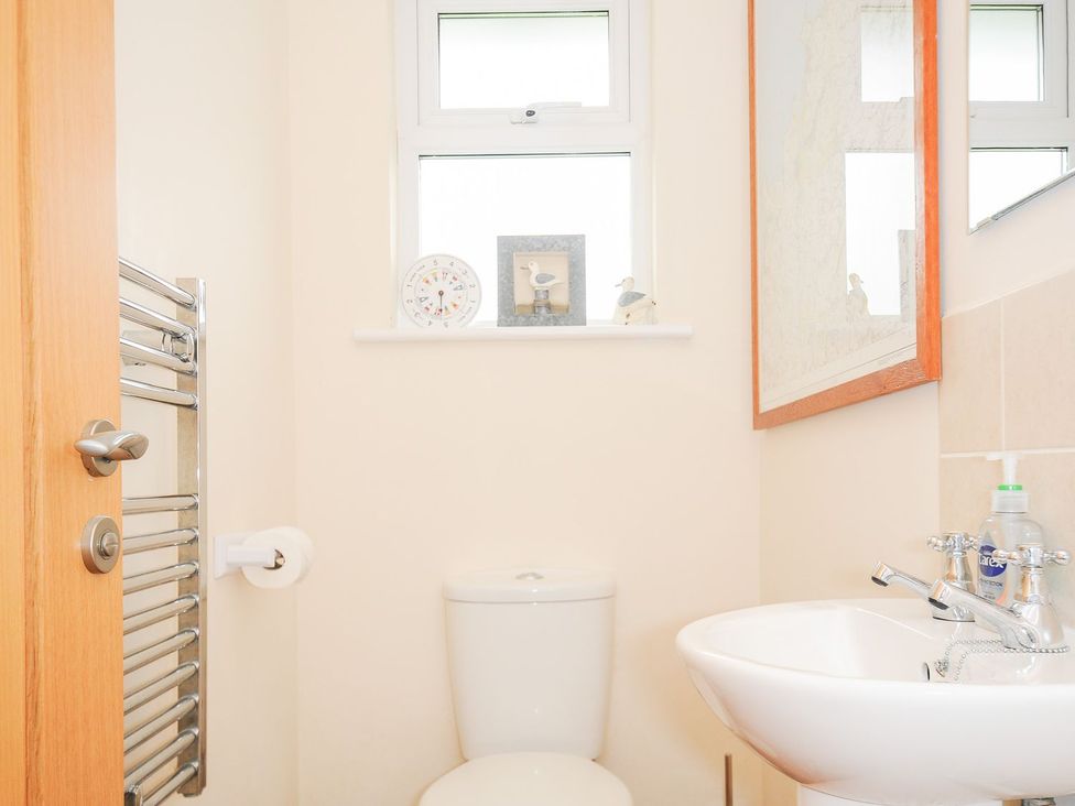 A bathroom with a toilet and sink at Chimings in Rock