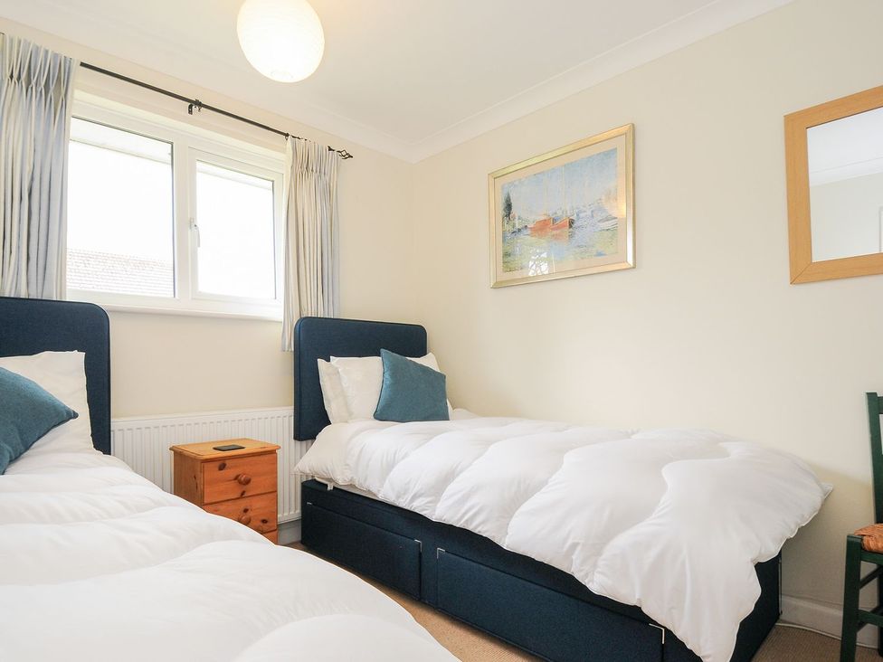 A bedroom with two beds and a window at Chimings in Rock