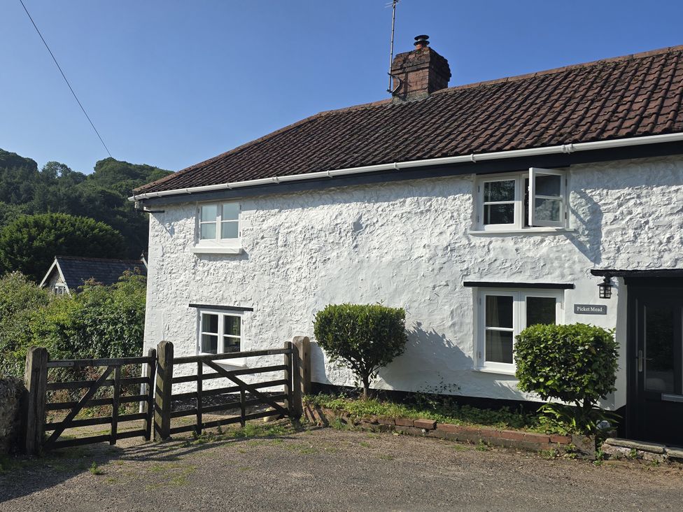 A house with a gate and bushes at Picket Mead Southleigh near Colyton