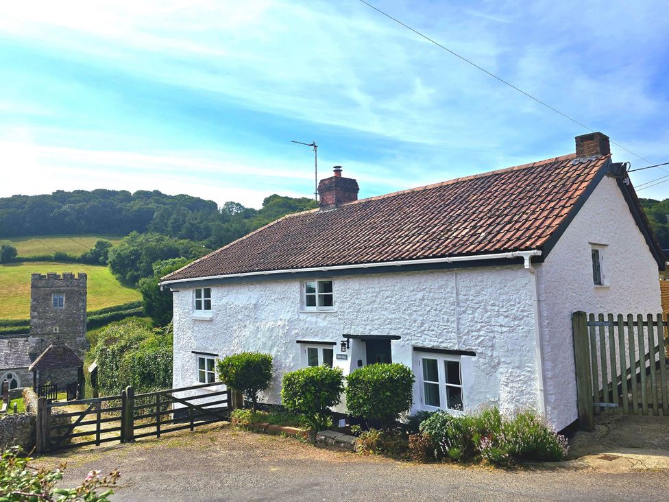 A house with a gate and plants at Picket Mead Southleigh near Colyton