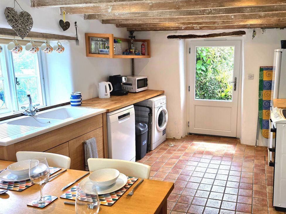 A kitchen with a sink and appliances at Picket Mead Southleigh near Colyton