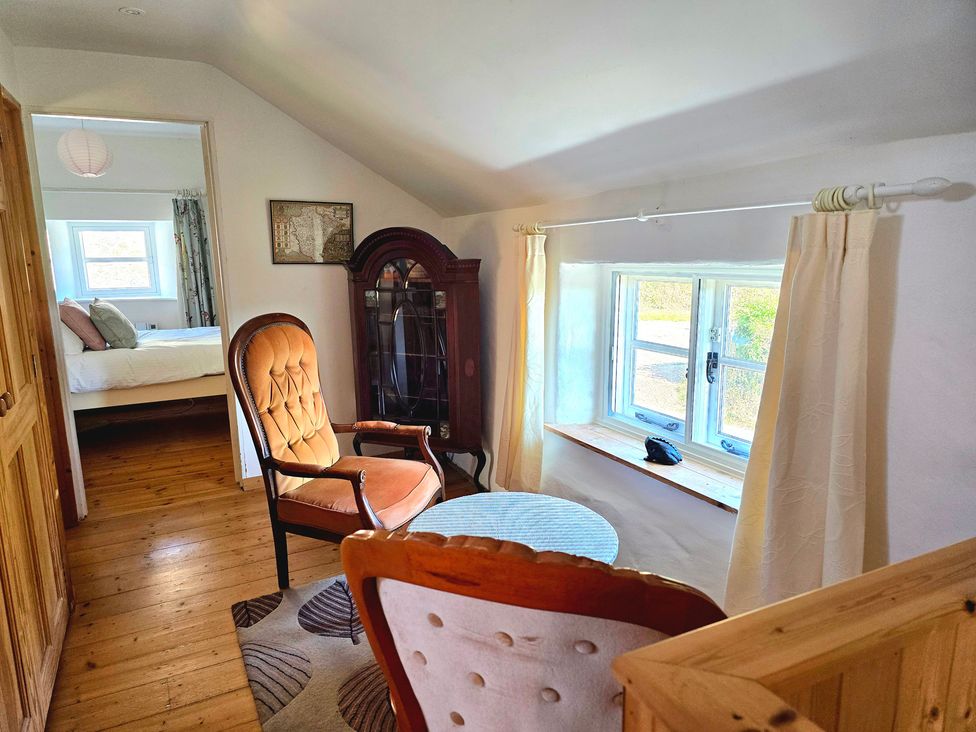 A snug with a chair and table at Picket Mead Southleigh near Colyton