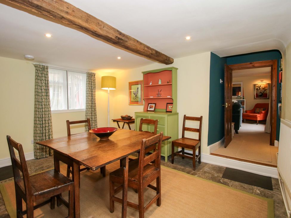 A dining room with a wooden table and chairs at 41 High Street Bishop's Castle