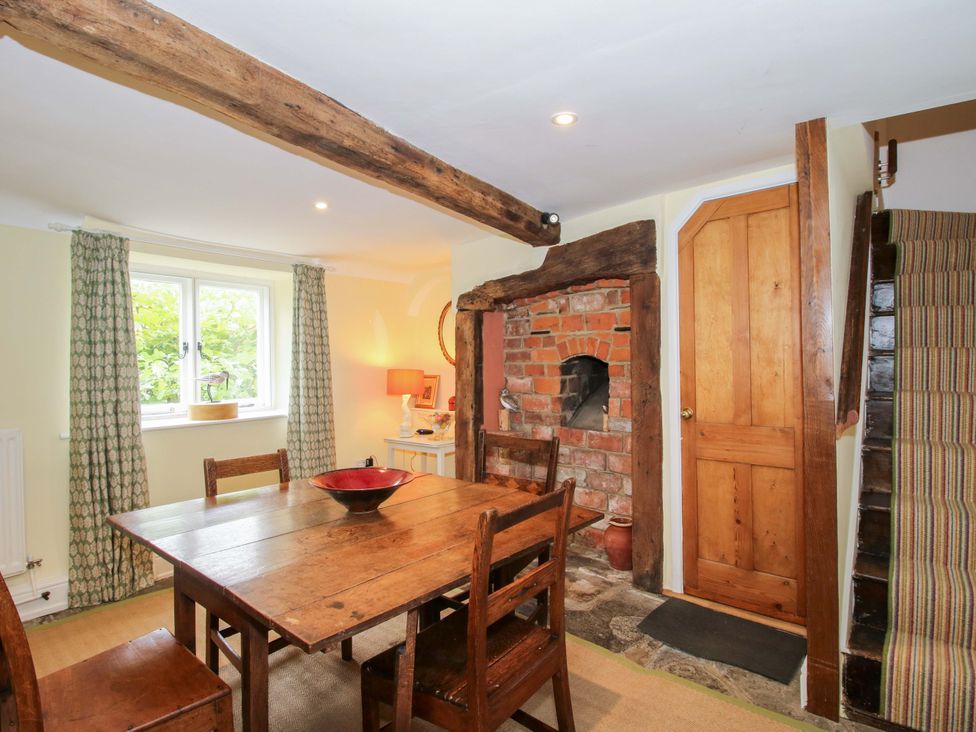 A dining room with a table and chairs at 41 High Street Bishop's Castle