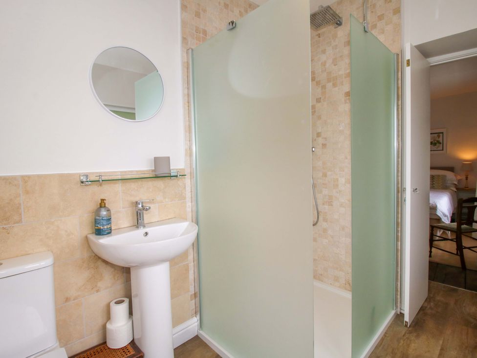 A bathroom with a shower and sink at 41 High Street Bishop's Castle