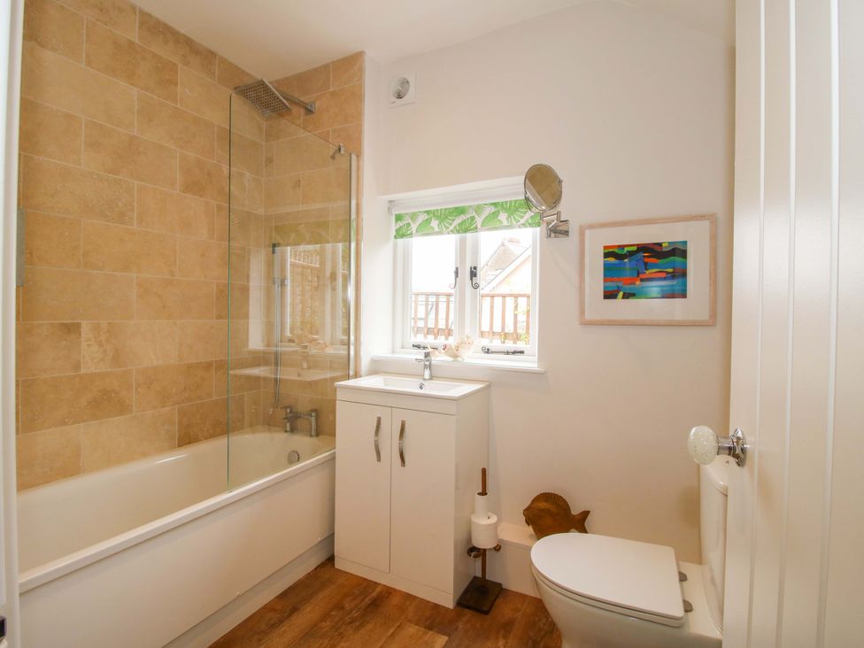A bathroom with bathtub and sink at 41 High Street Bishop's Castle