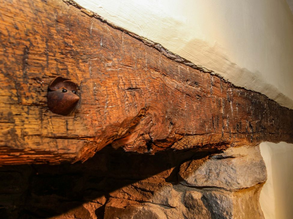 A wooden beam along the wall at 41 High Street, Bishop's Castle