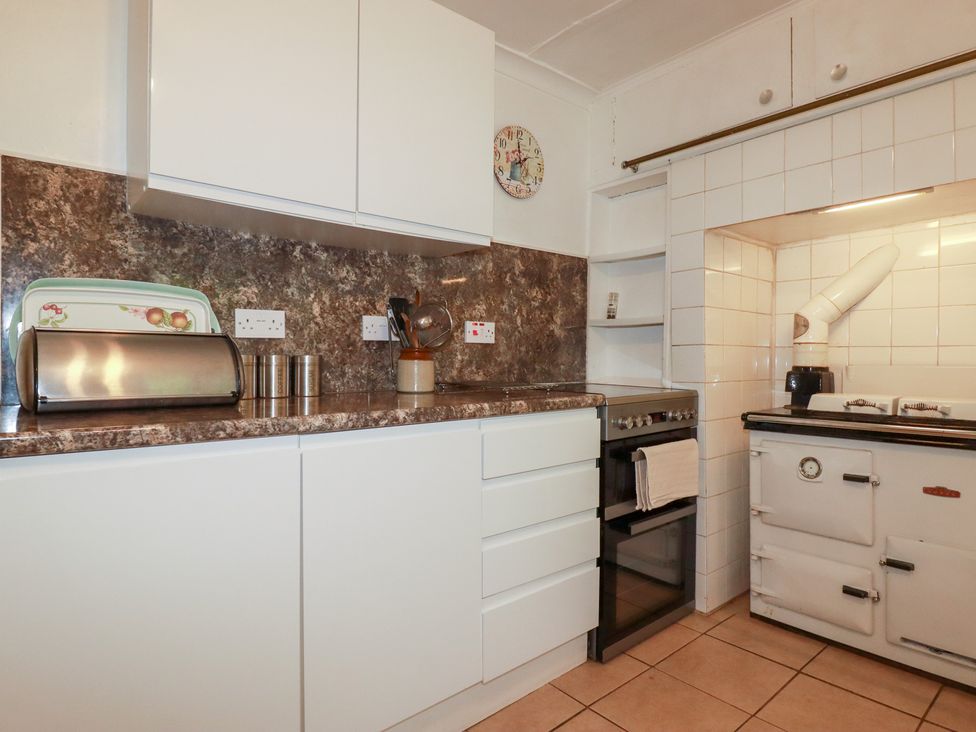 A kitchen with cabinets and an oven at Nanvivian Feock near Truro