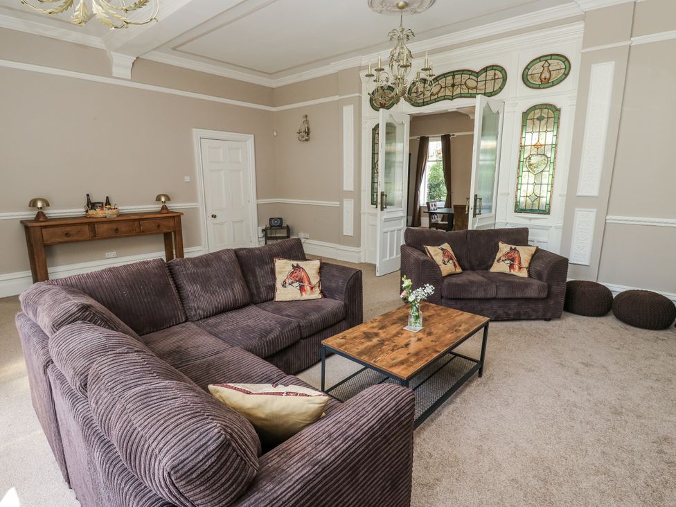 A living room with a sofa and coffee table at Cold Spring House in Cullingworth