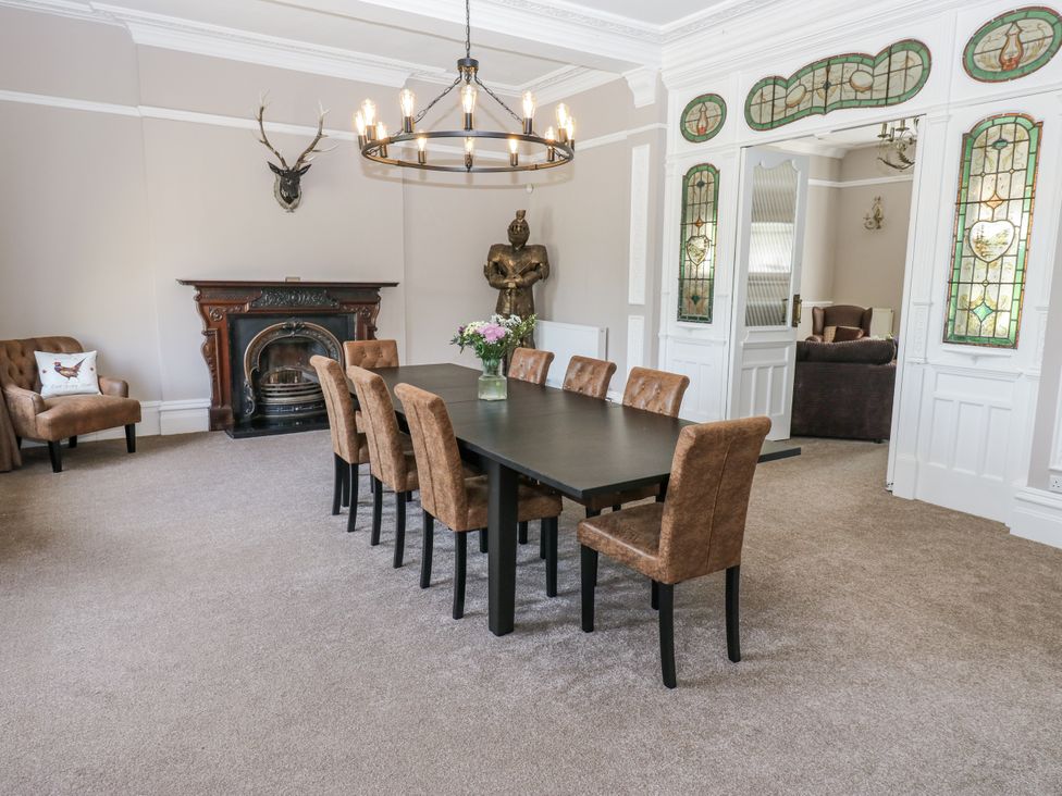 A dining room with a table and chairs at Cold Spring House in Cullingworth