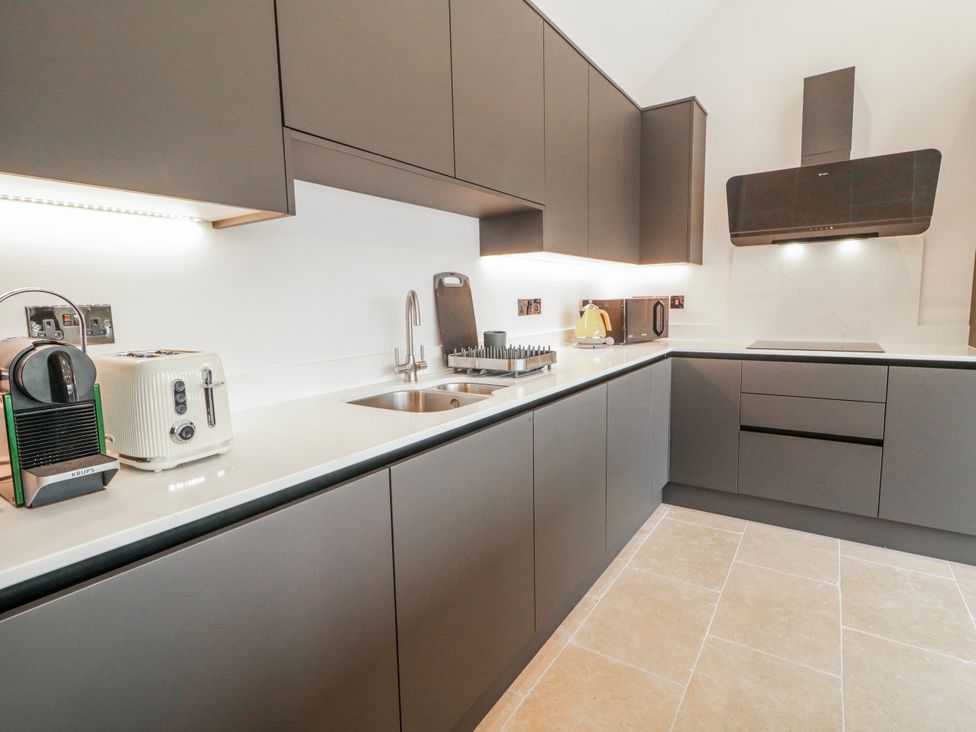 A kitchen with a sink and appliances at Cloneytrace Mines Broughshane