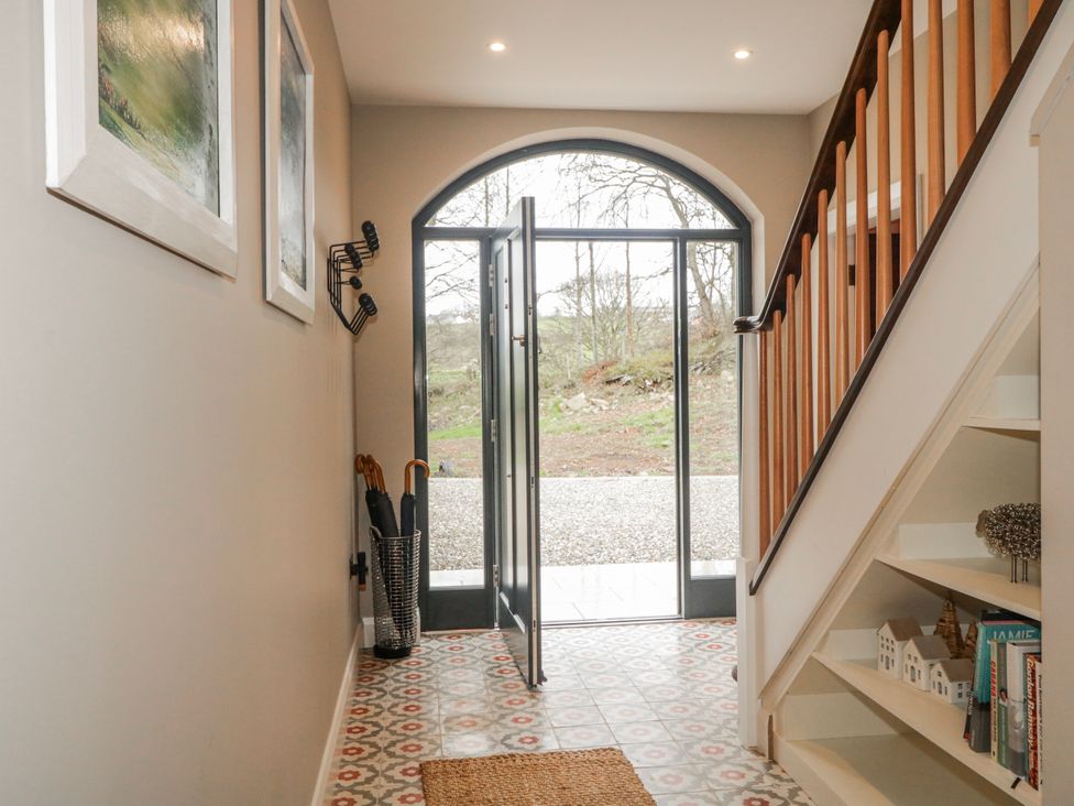 A hallway with a view of the door and stairs at Cloneytrace Mines in Broughshane
