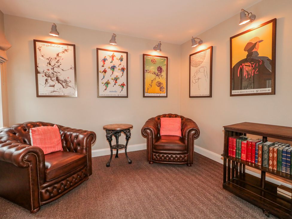 A snug with armchairs and artwork at Cloneytrace Mines in Broughshane